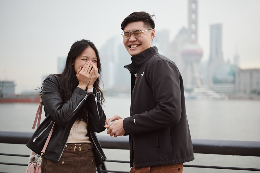 A surprise marriage proposal with the Lujiazui skyline across the Huangpu River.
