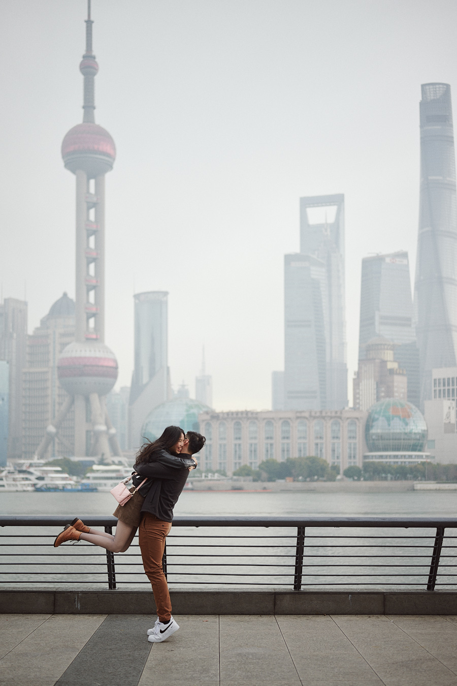 Bryan embracing Hong Yun after she accepts his marriage proposal on the Bund.