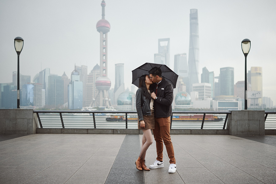 Bryan and Hong Yun celebrating their engagement against the Shanghai skyline.