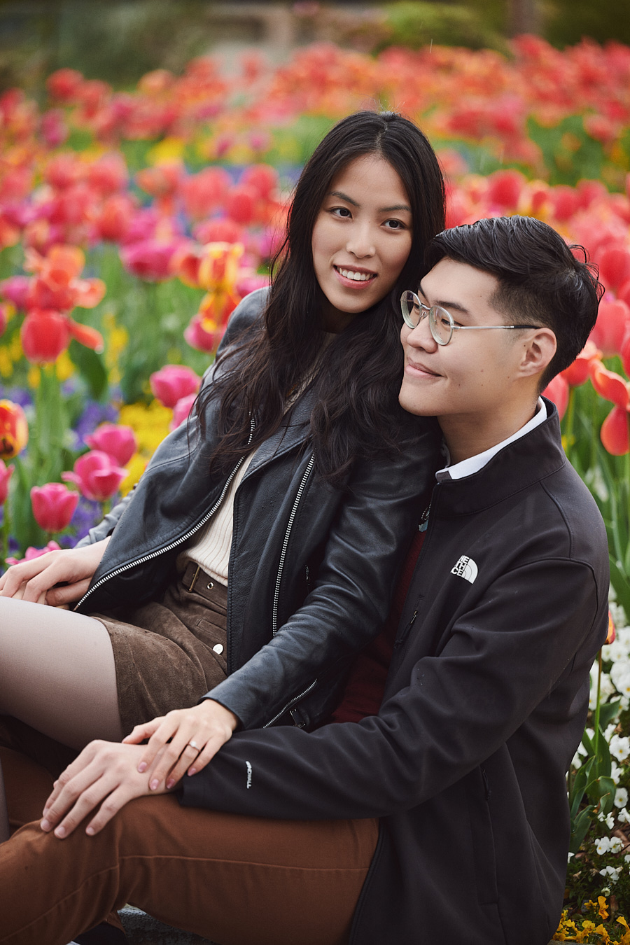Bryan and Hong Yun laughing together during their engagement photoshoot in Shanghai.