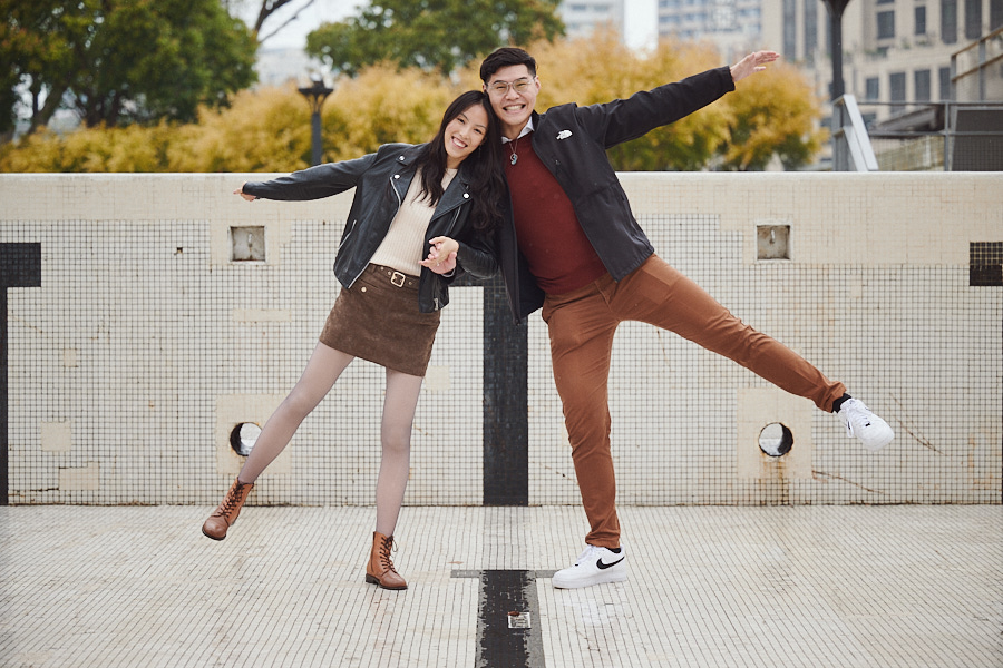 Bryan and Hong Yun laughing together during their engagement photoshoot in Shanghai.